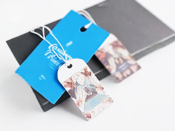 Discover custom hang tags and clothing tags that elevate your brand! Order custom printed hang tags in various shapes and finishes, perfect for any product.